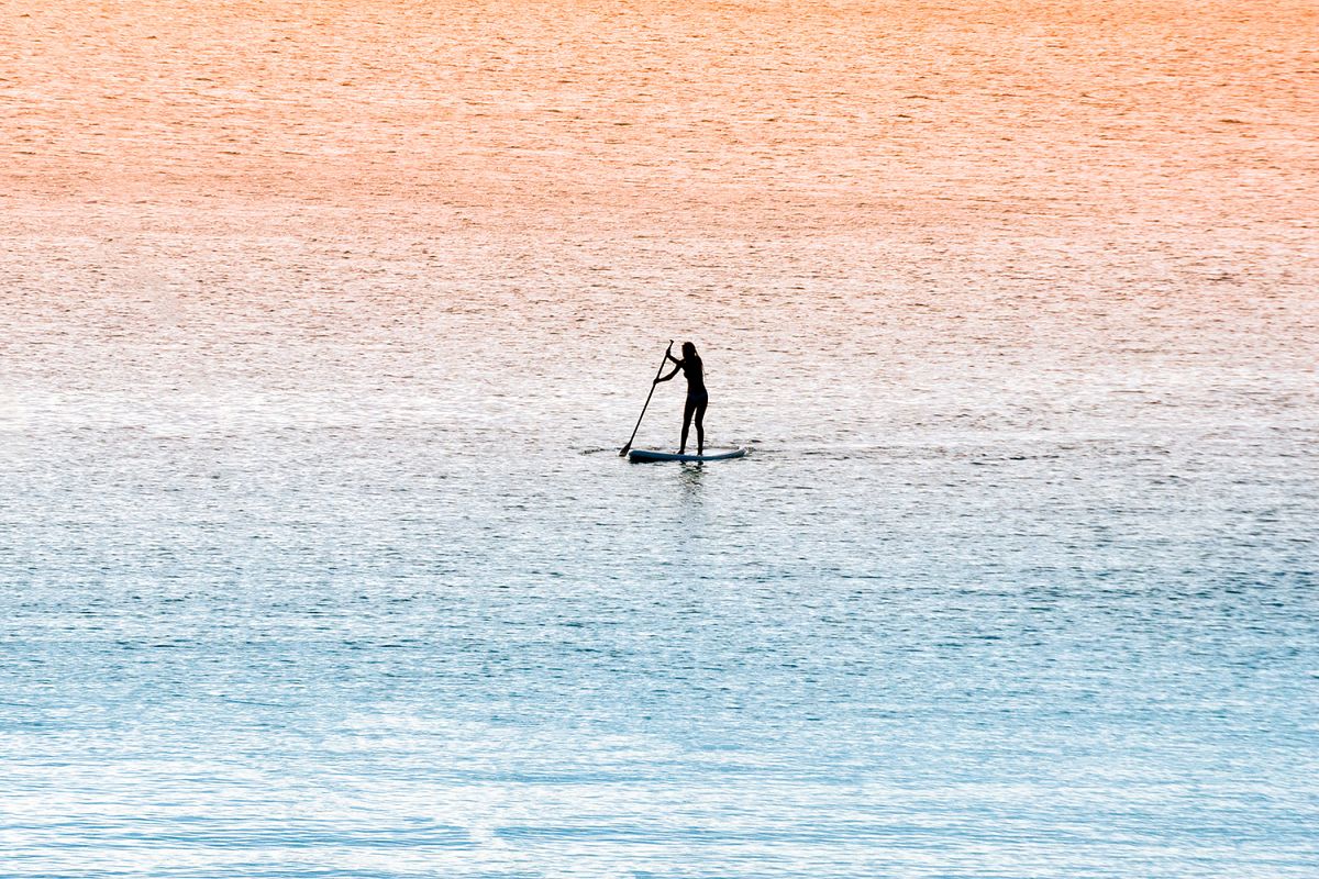 Standup paddle surfer girl example image