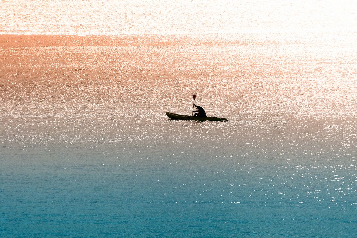 Sea canoeist at dawn example image